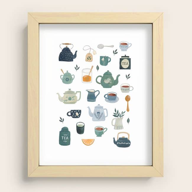 Framed artwork featuring various illustrated tea-themed items, including teapots, cups, and a spoon