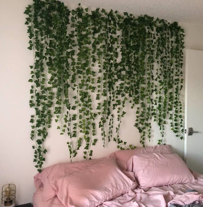 Reviewer photo of the vine garlands above their bed