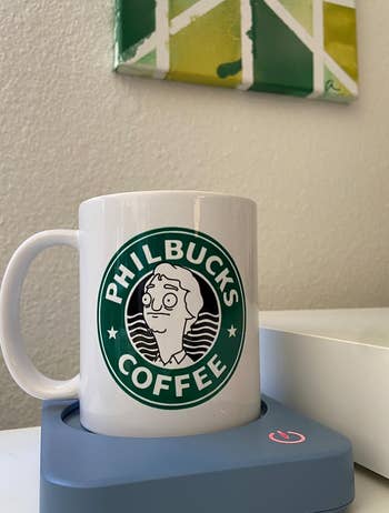 another reviewer's Philbucks mug on the blue warming device