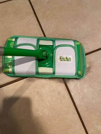 reviewer image of the reusable pad on a Swiffer