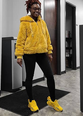 Reviewer in electric yellow lace up sneakers  