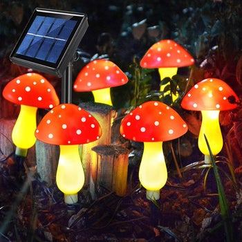 the six lit-up mushrooms next to solar power unit