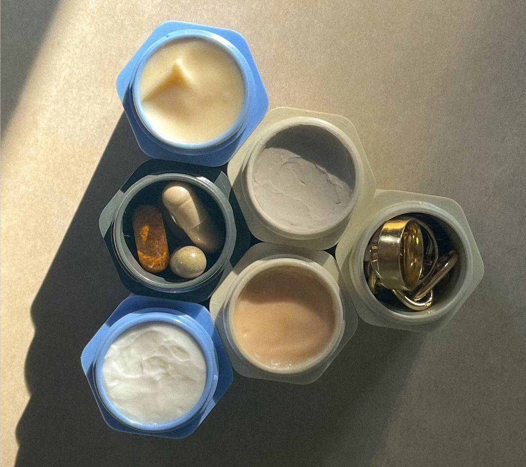 six different containers each filled with jewelry or different toiletries