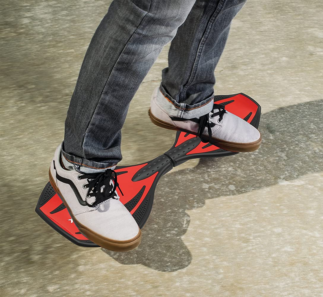 Model's sneakers standing on red and black board