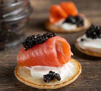 prepared piece of roe and blini with lox