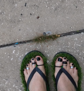a reviewer wearing the flip flops 