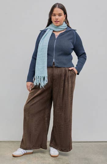 a model wearing the same pants in brown 