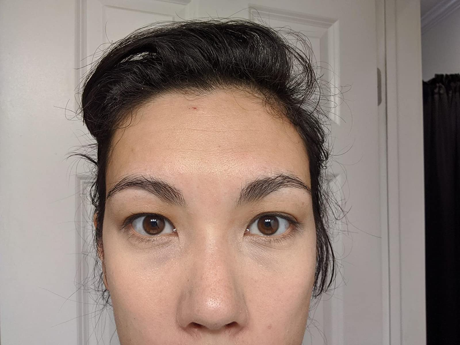 a reviewer photograph  of the aforesaid  reviewer with the concealer applied 