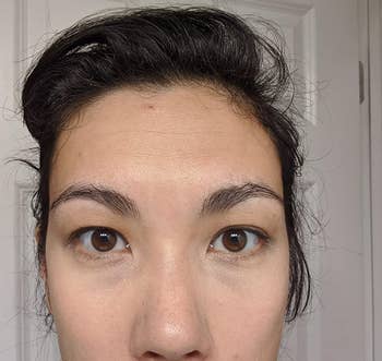 a reviewer photo of the same reviewer with the concealer applied 