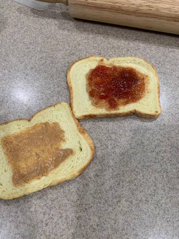 two slices of bread, one with peanut butter and one with jelly