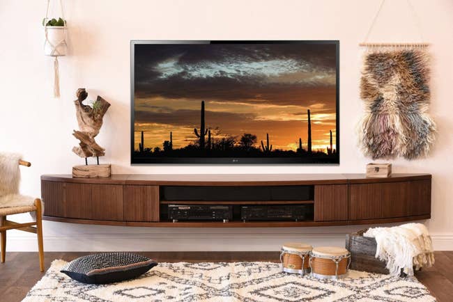 Image of the arc-shaped brown TV stand