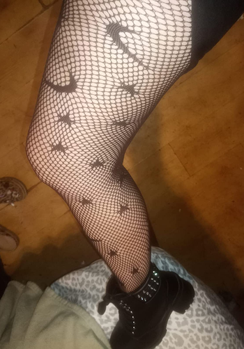 Image of reviewer wearing moon and stars tights