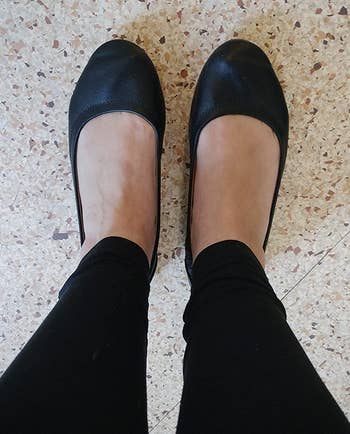 reviewer wearing the black flats