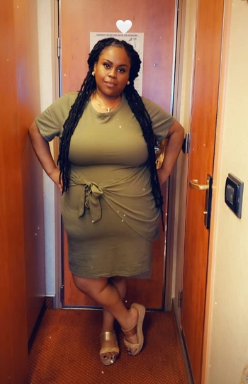 a reviewer wearing the tie-waist t-shirt dress in khaki green 