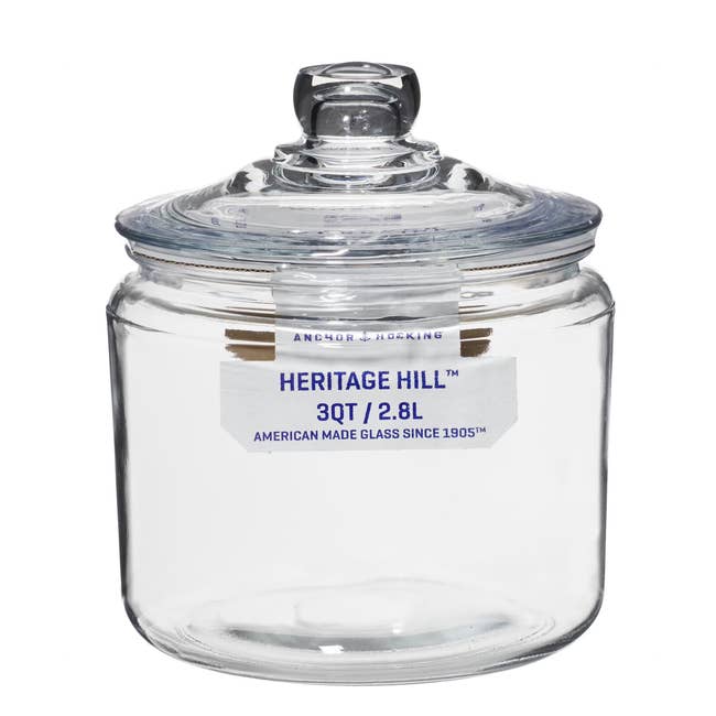 Clear glass jar with lid, labeled 