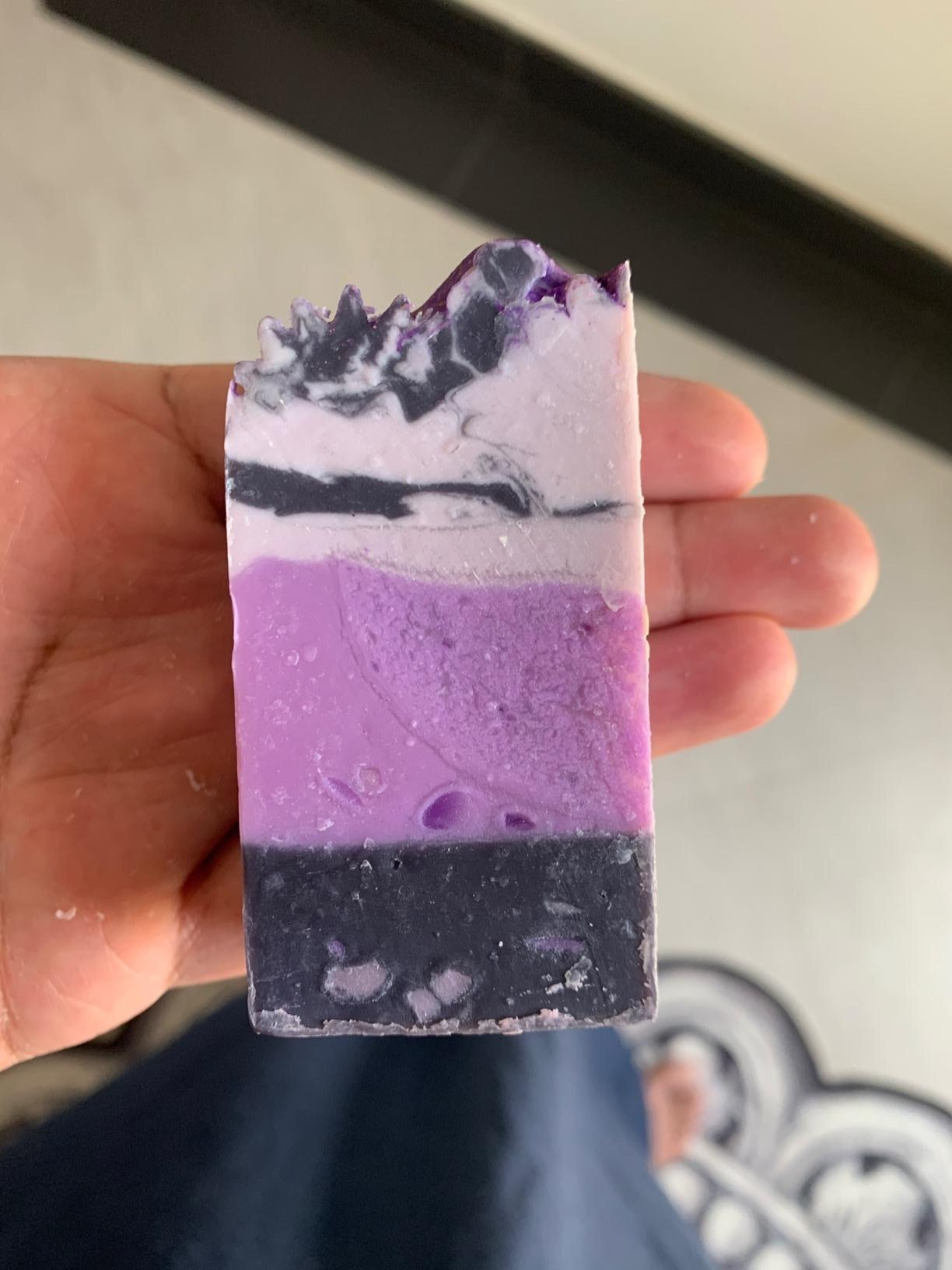 a reviewer holds purple soap