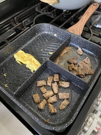 Reviewer using pan on stove to cook breakfast