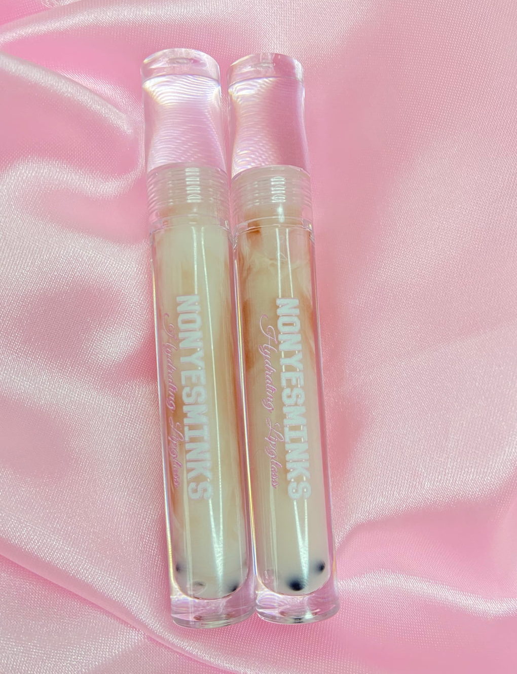 two lip gloss tube that are made to look like milk tea