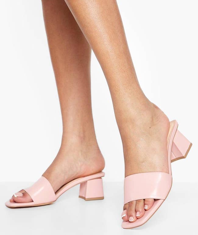 model wearing light pink low-heel sandals