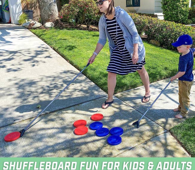image of an adult and a child playing shuffleboard outside