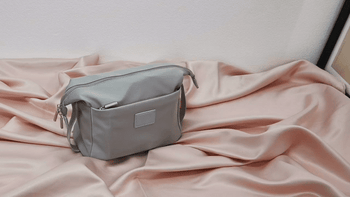 GIF of makeup products being store in gray fold-down bag