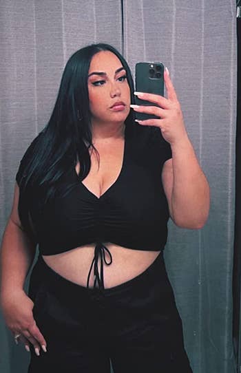 a reviewer wearing the crop top in black