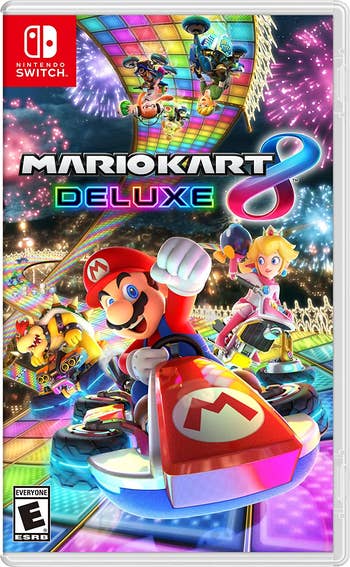 the mario kart 8 deluxe box art showing mario and several other characters racing