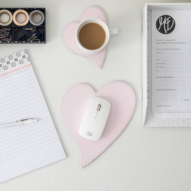 the pink heart coaster and mousepad on a desk