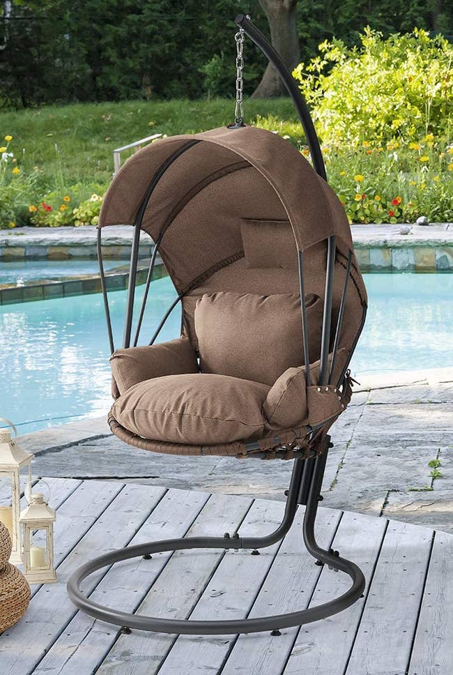 Image of the beige chair next to a pool