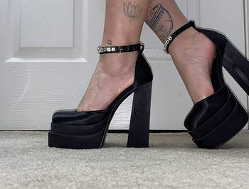 reviewer wearing the black heels