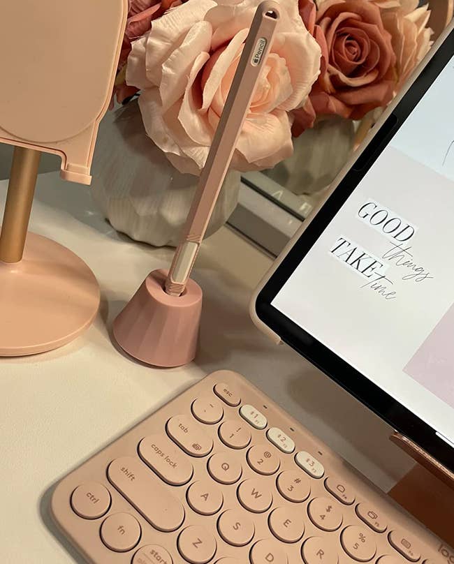 reviewer's pink desk setup with the pink version of the apple pencil stand