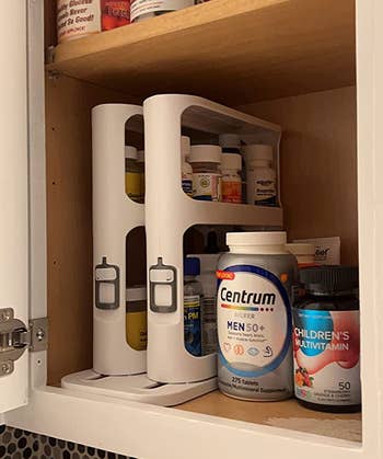 reviewer photo of the cabinet caddy in a medicine cabinet