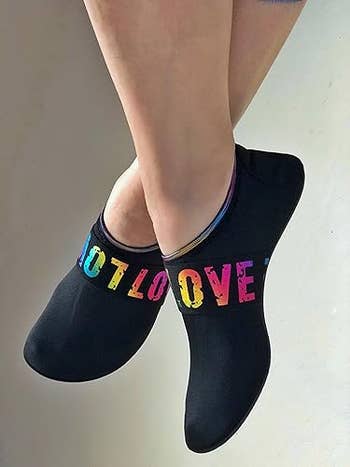 Person wearing achromatic  ankle socks with 