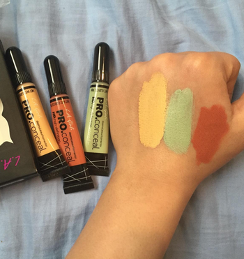 reviewer showing the three correctors and a swatch of each on their hand