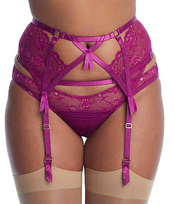 model wearing the garter belt and matching underwear in purple