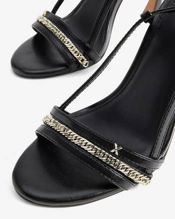close up on toe strap with chain detail