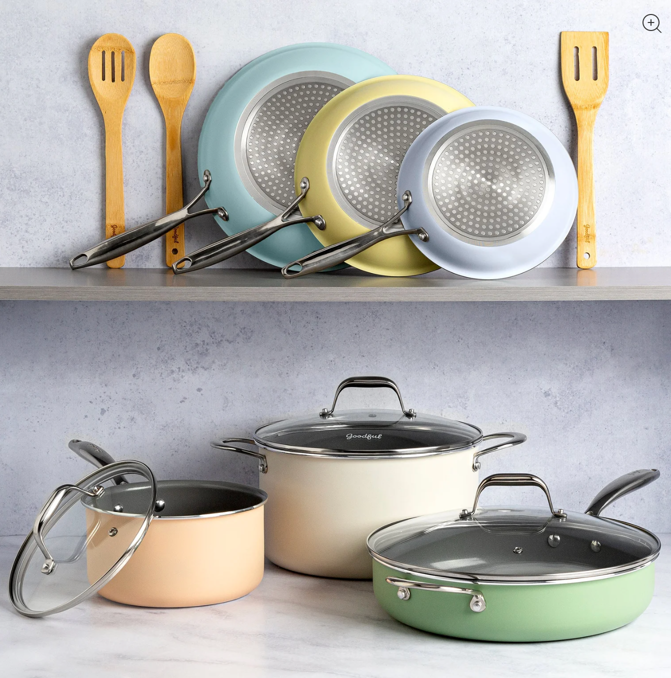 The cookware set with pots and pans in various pale pastel colors and clear handled lids 
