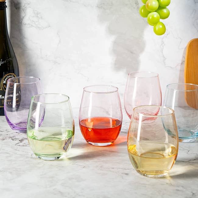 six glasses sitting on a counter