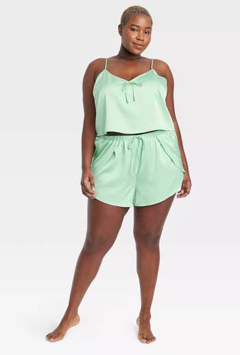 model in mint green set with bow detail at chest