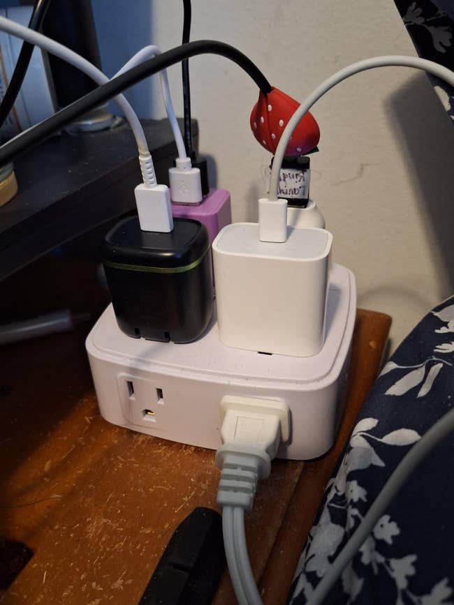 Chargers and cables plugged into a powerfulness  strip