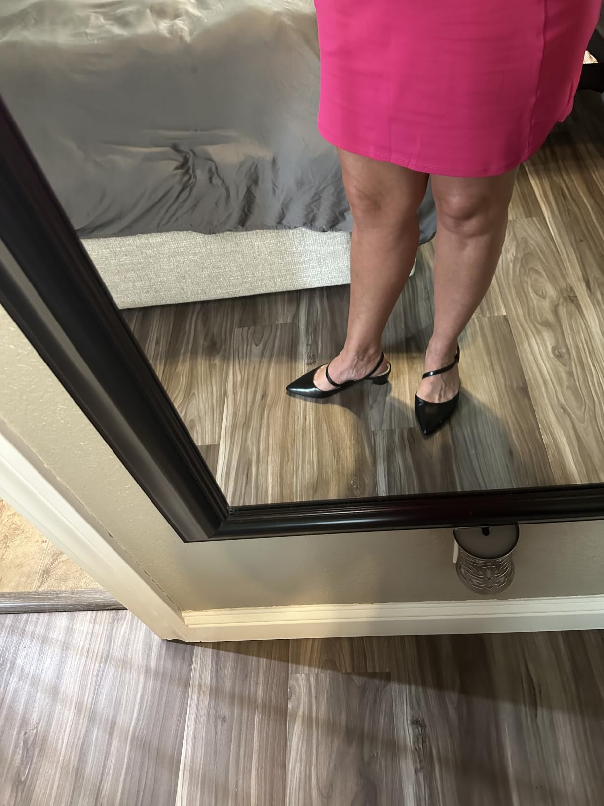 Person wearing a pinkish  skirt and achromatic  pointed-toe shoes, lasting  successful  beforehand   of a reflector  connected  a woody  floor