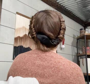 reviewer wearing their hair up in the headband