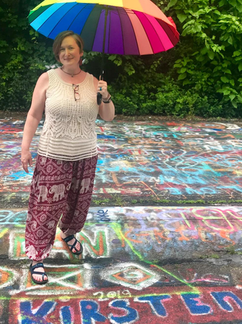 another reviewer wearing the pants in a maroon print