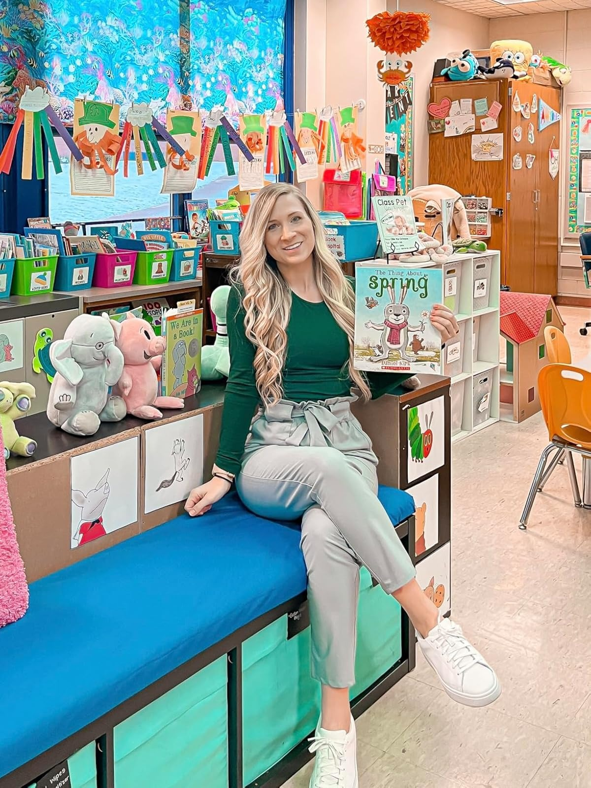 Person successful  a schoolroom  holding a publication  titled 