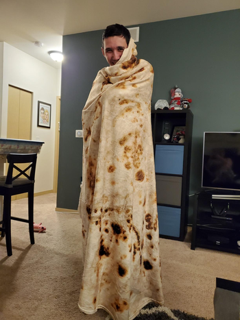 reviewer wrapped in tortilla blanket