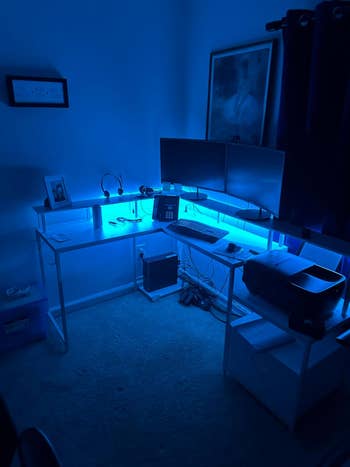 a reviewer's desk with blue LED lights illuminated 