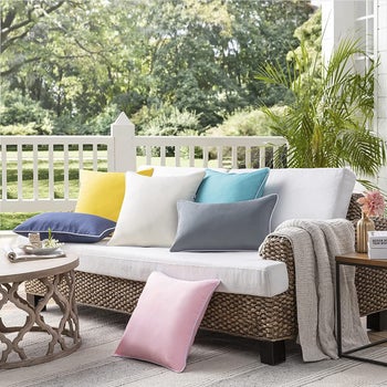 an array of weatherproof throw pillows