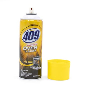 Yellow spray bottle with cap off that reads 