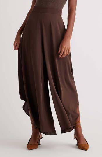 a model wearing the pants in brown 