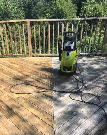 Reviewer image of a deck being washed with half of it looking gray and dull, and the other half cleaned